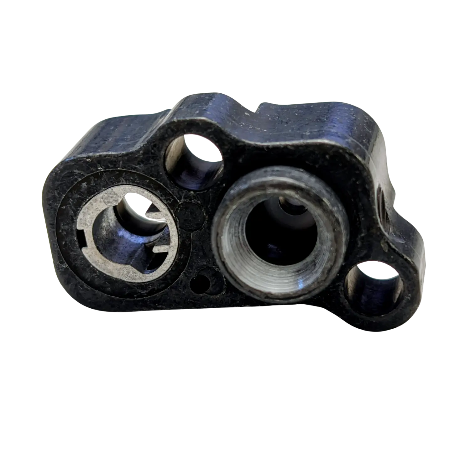 Schwarzer Einsatz-Ventilblock für HW100 mit mehreren runden Öffnungen und Metallinnenringen.