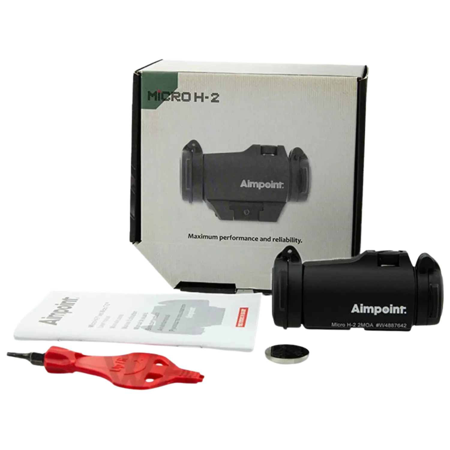 Aimpoint Micro H-2 Zielgerät in schwarzer Farbe, verpackt in einer Box mit Anleitung und Zubehör. Sichtbar sind eine Batterie, ein Schraubenschlüssel und ein Handbuch.