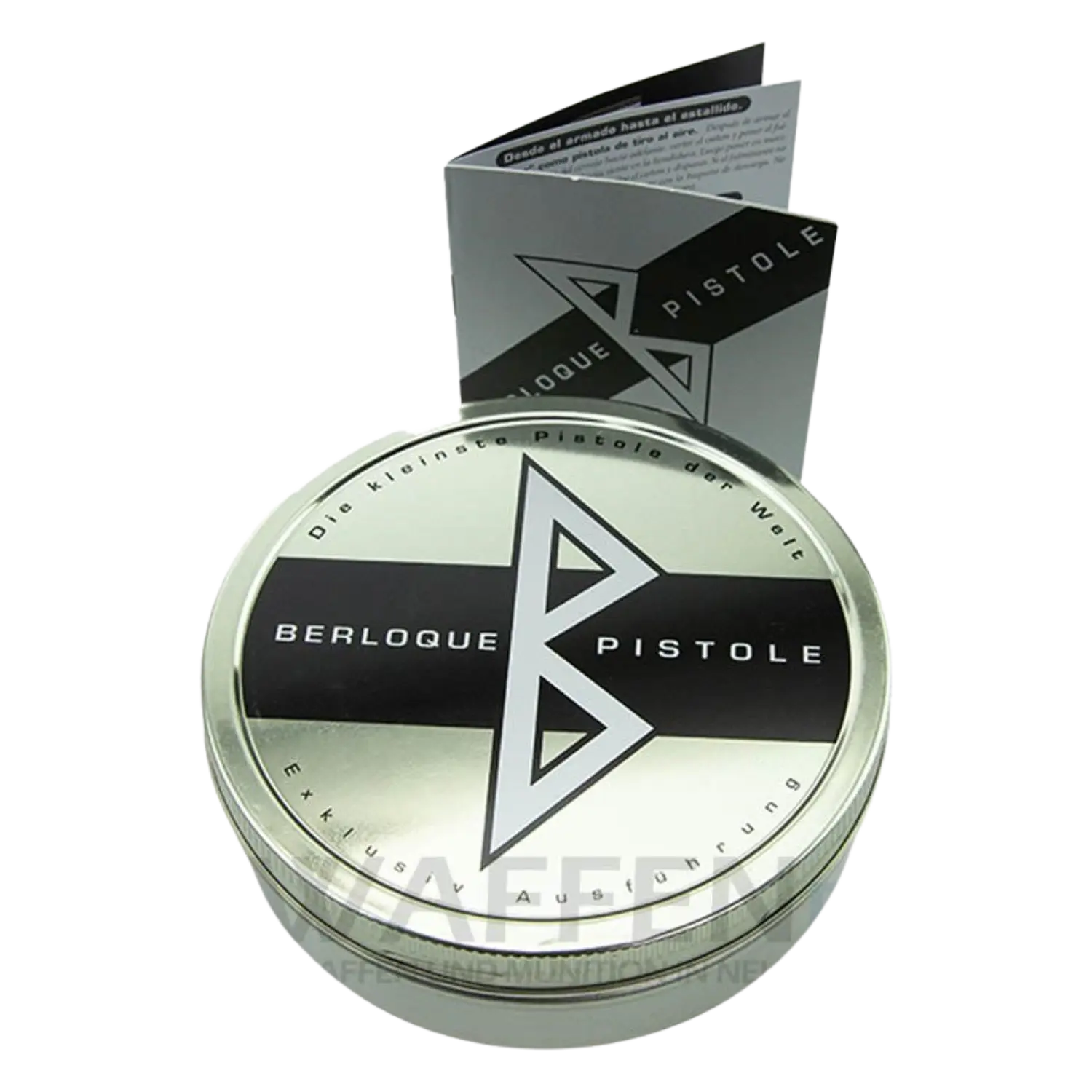 Runde Metall-Geschenkdose mit Aufschrift 'Berloque Pistole' und 'Die kleinste Pistole der Welt', dazu ein aufgeklapptes Faltblatt mit gleichem Logo.