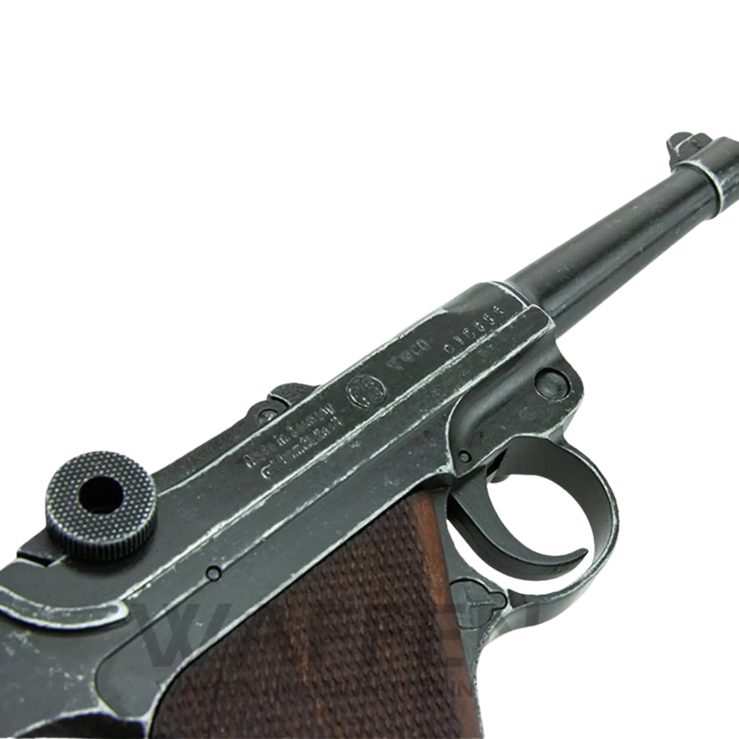 Schreckschusswaffe mit langem Lauf, schwarzem Metall und braunem Griff, seitliche Gravur mit Seriennummer und Herstellerangaben.
