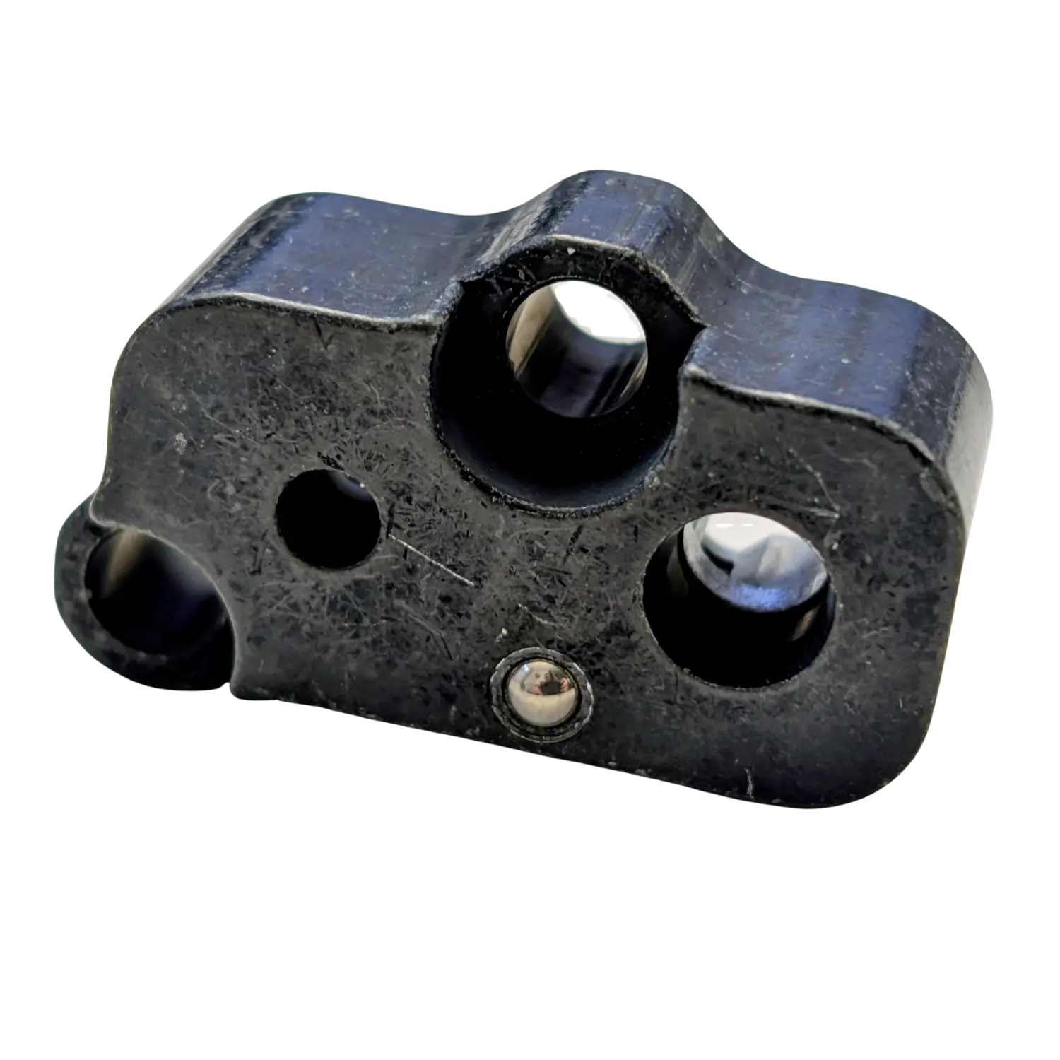 Schwarzer Einsatz-Ventilblock für HW100 mit mehreren runden Öffnungen und metallischer Kugel in der Mitte.